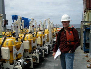 Sheehan in the South Pacific with ocean-bottom seismometers. 
These devices record Earth’s tremors in ocean locations. 