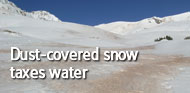 Dust-covered snow taxes water